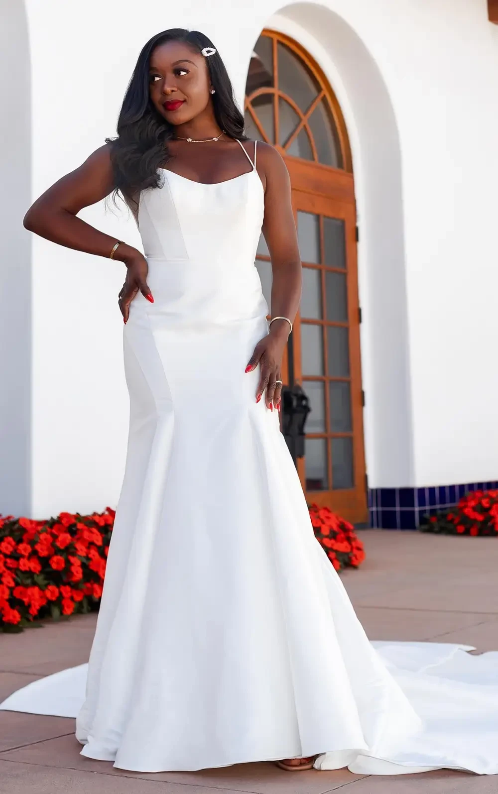 model is wearing a sleeveless mikado bridal gown